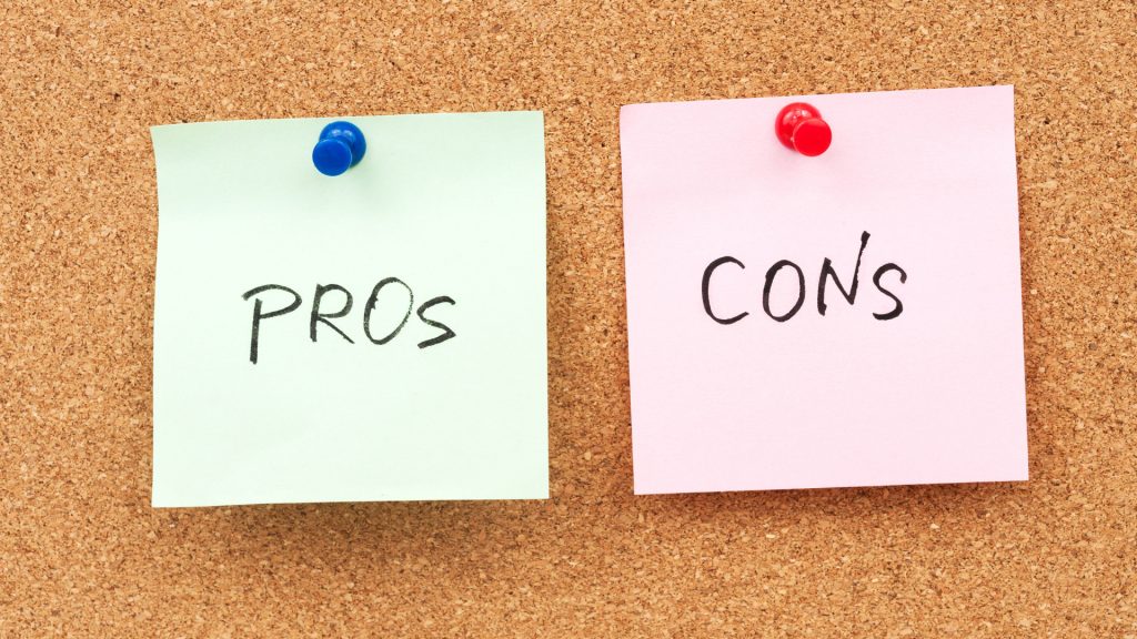 Pros of hiring professional accountants for small business financial management on a corkboard.