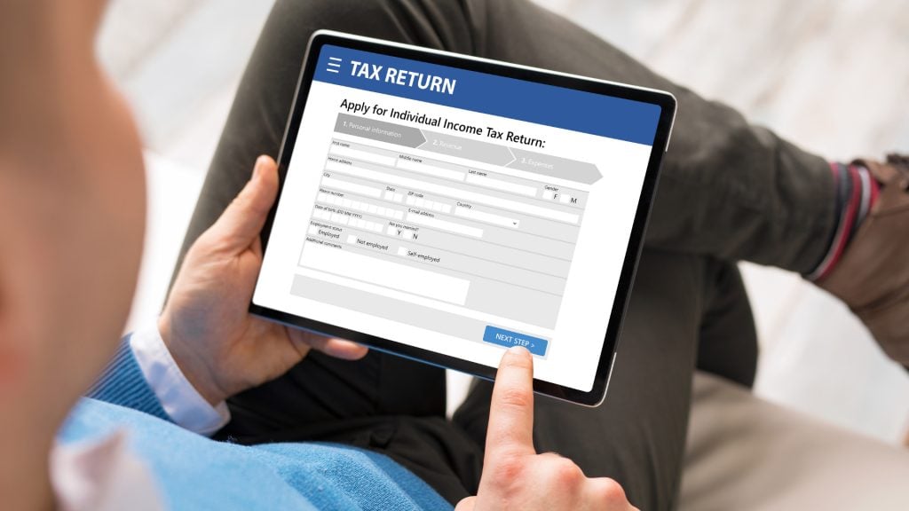 Online tax return form being filled out on a tablet, representing professional accounting and tax services by GMS Accountants.
