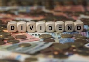 Picture of dice spelling the word Dividend
