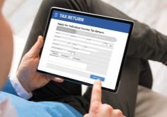 Online tax return form being filled out on a tablet, representing professional accounting and tax services by GMS Accountants.