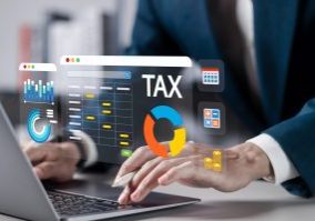 Tax calculations on digital interface with financial icons, accountant analyzing tax data with charts and graphs.