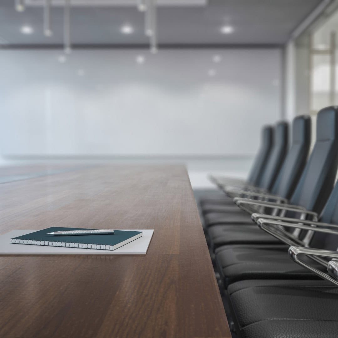 Professional conference room with empty chairs and a wooden table, ideal for business meetings and financial consultations. Perfect environment for GMS Accountants’ professional accounting and tax services.