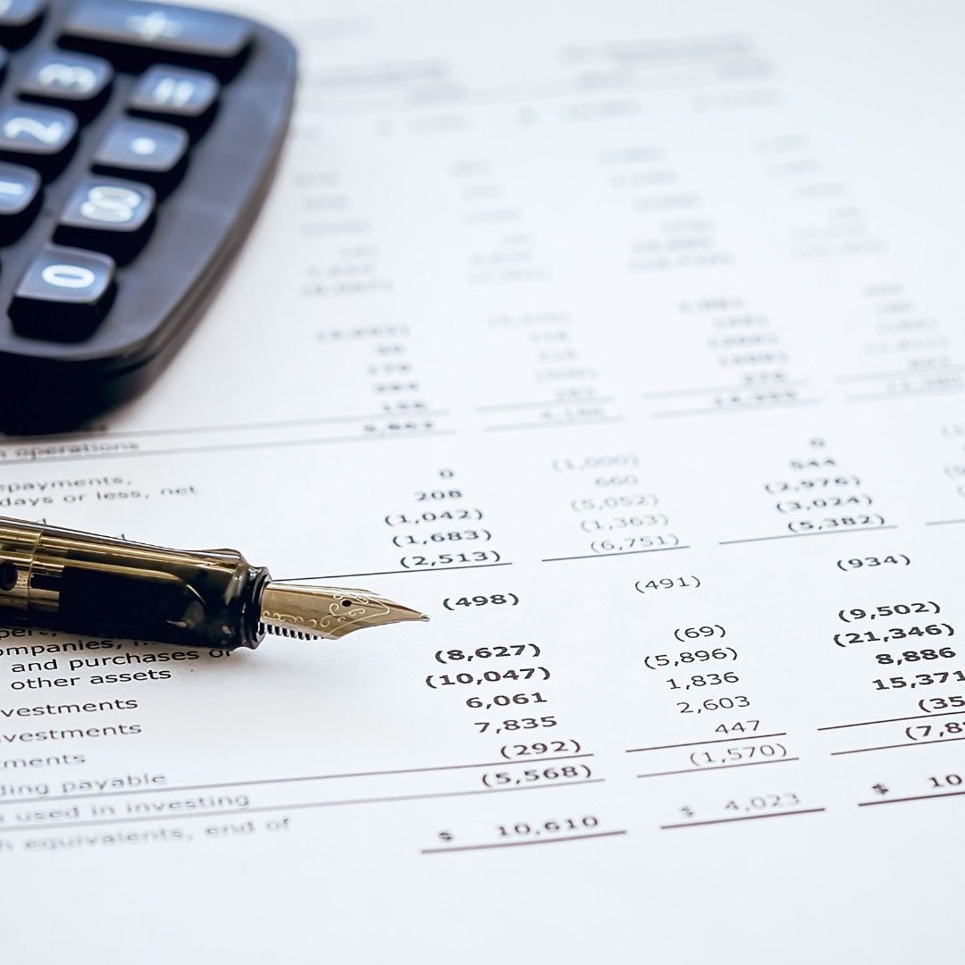 Accurate financial calculations with calculator and pen on accounting document, professional bookkeeping, accounting, tax preparation, financial consultancy, business finance services, GMS Accountants.