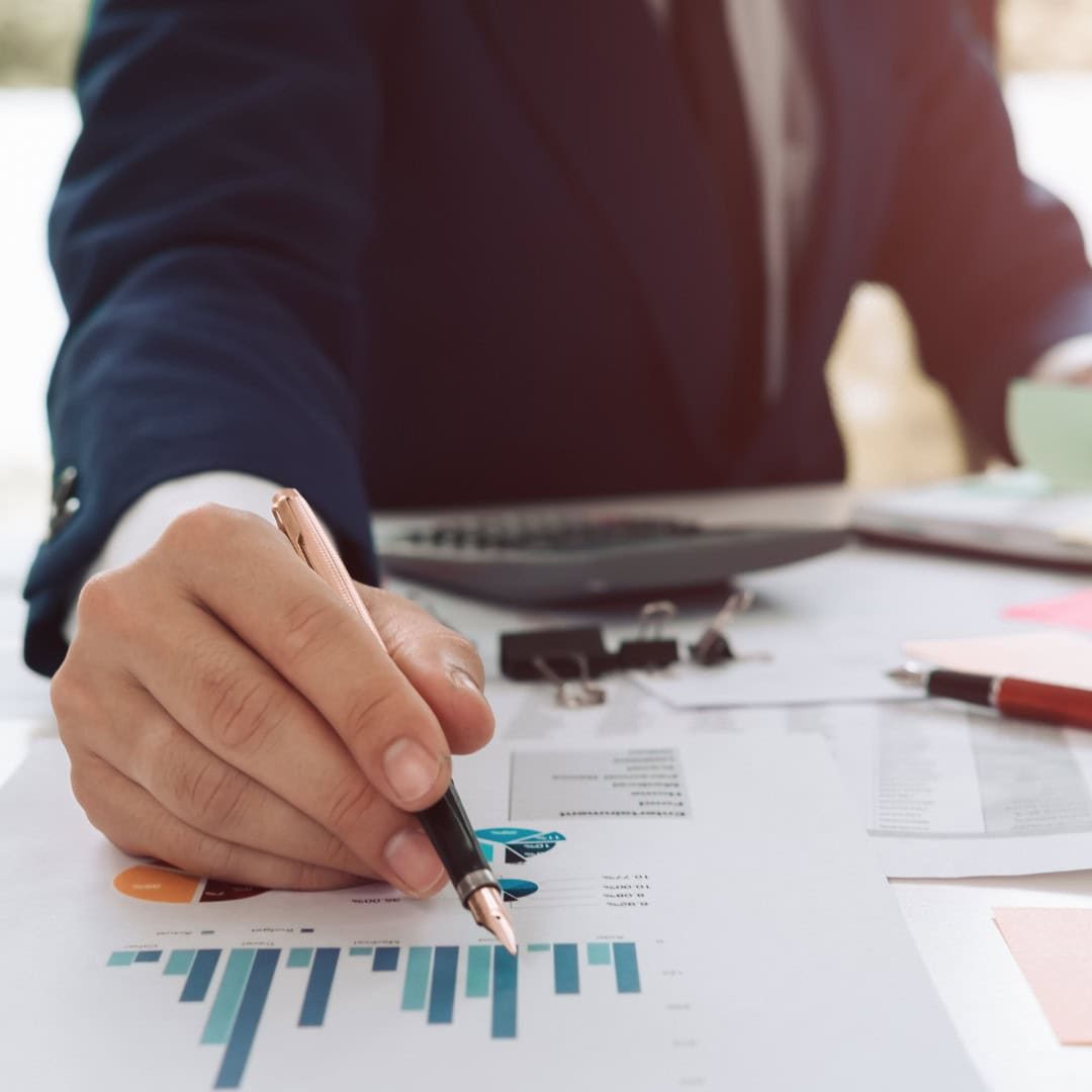 Accountant working on financial documents, business analytics, and tax reports for small businesses and entrepreneurs in the UK, professional financial services, GMS Accountants.